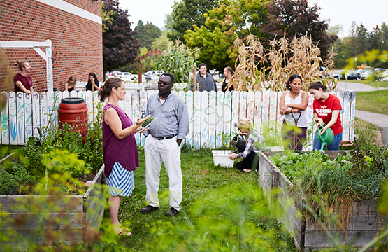 faculty and students gathered at the campus garden