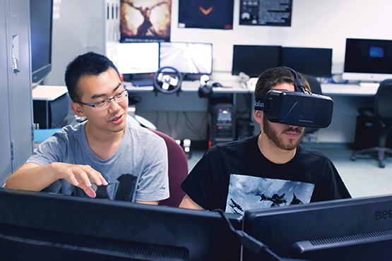 students in computer lab wearing vr headset