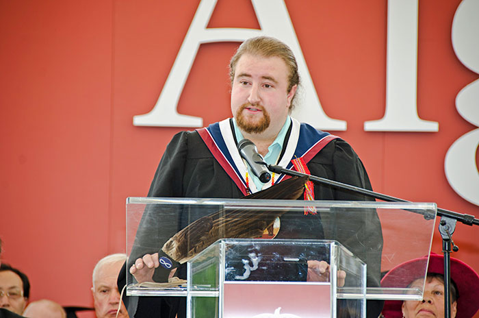 man giving speech at graduation