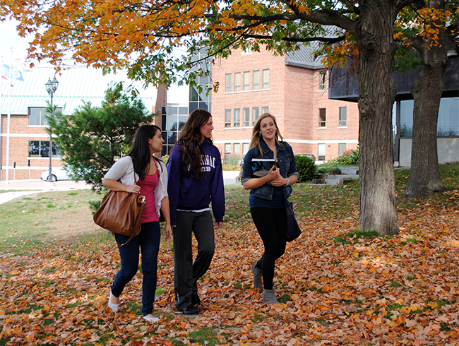 students walking outside in autumn