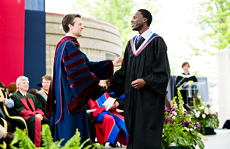 student receiving diploma