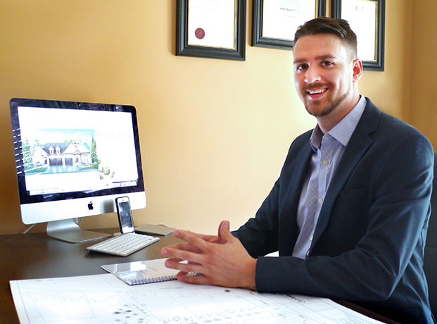 student smiling while sitting at desk