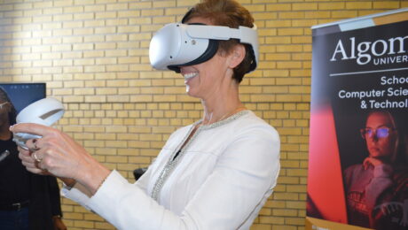 Algoma University President and Vice-Chancellor Asima Vezina testing Unity AR/VR platform at NCoE launch in Brampton