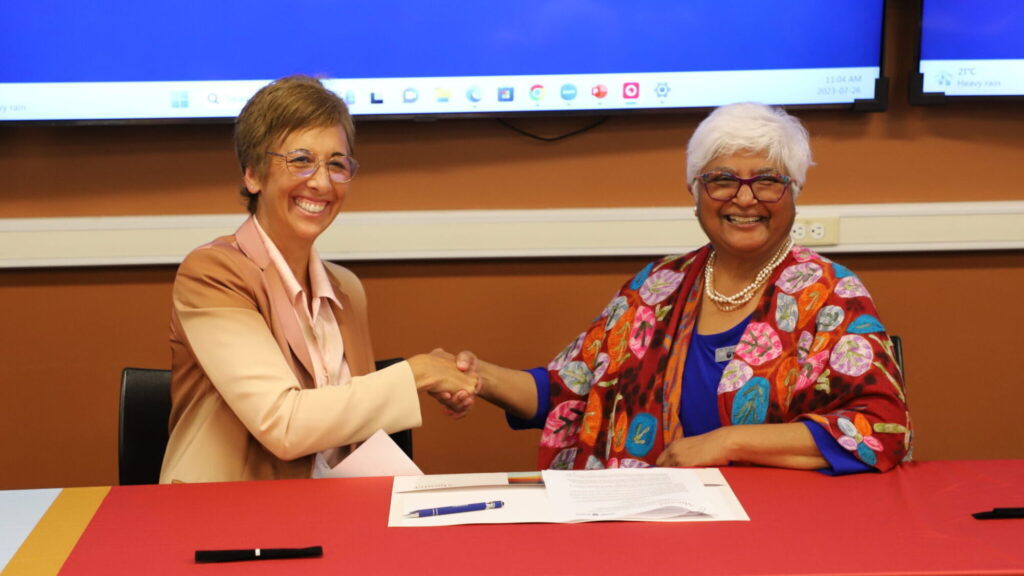 Asima Vezina and Sarita Verma Signing Agreement