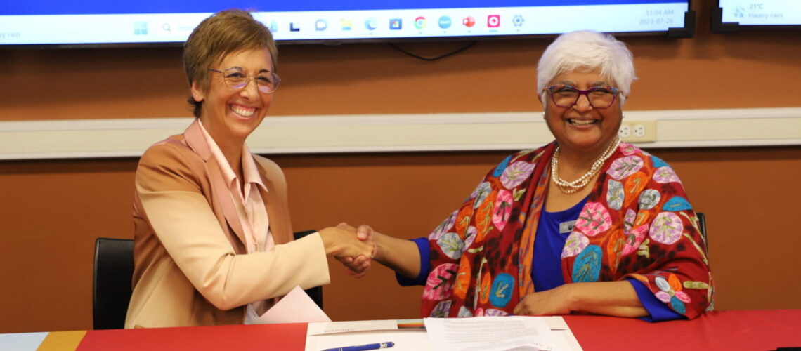 Asima Vezina and Sarita Verma Signing Agreement