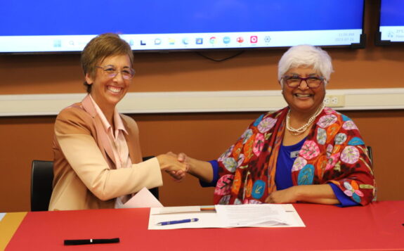 Asima Vezina and Sarita Verma Signing Agreement