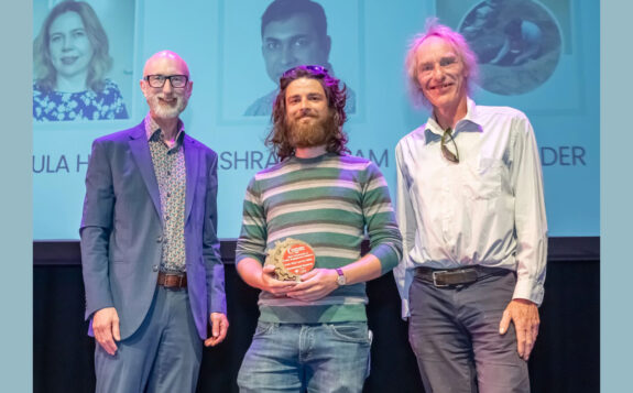 Colin Elder receiving an award