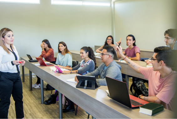 Students in class interacting with Professor