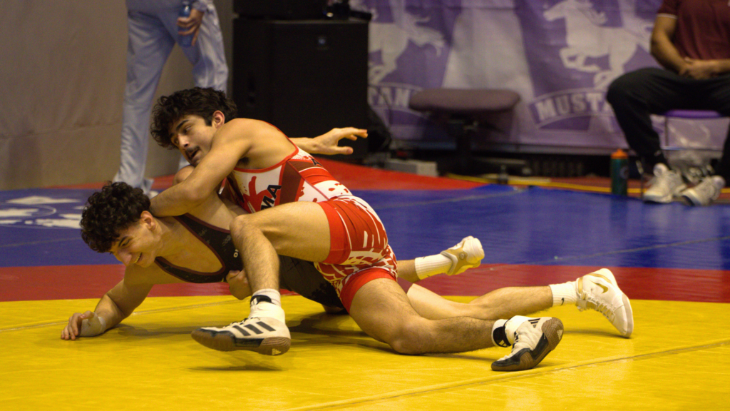Website Header: First-year finance and economics student Brandon Carrillo claimed a silver medal in the 57 kg weight class.