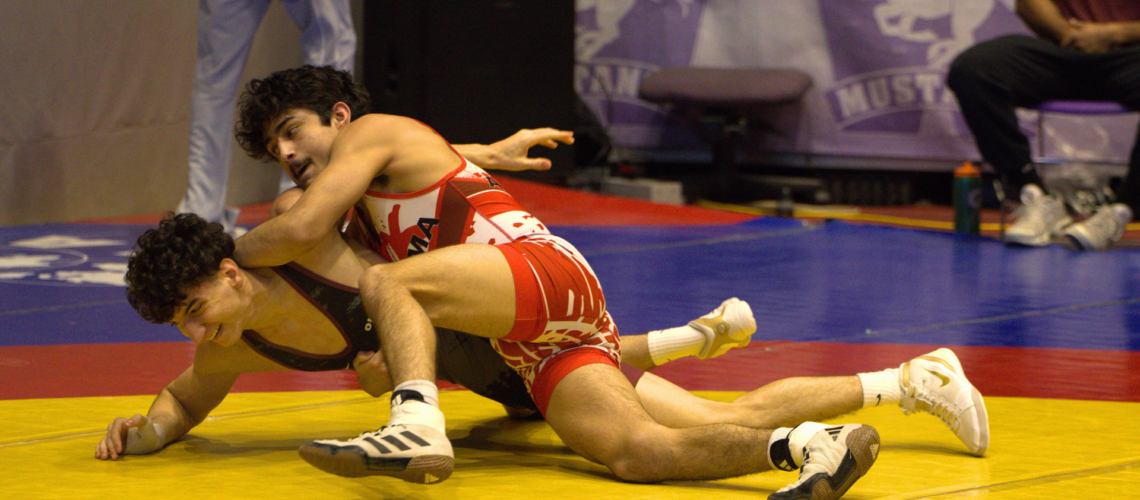 Website Header: First-year finance and economics student Brandon Carrillo claimed a silver medal in the 57 kg weight class.