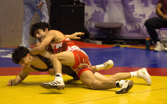 Website Header: First-year finance and economics student Brandon Carrillo claimed a silver medal in the 57 kg weight class.
