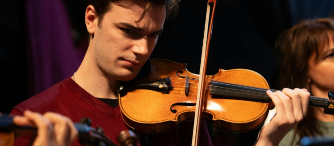 Website Header Student playing the violin
