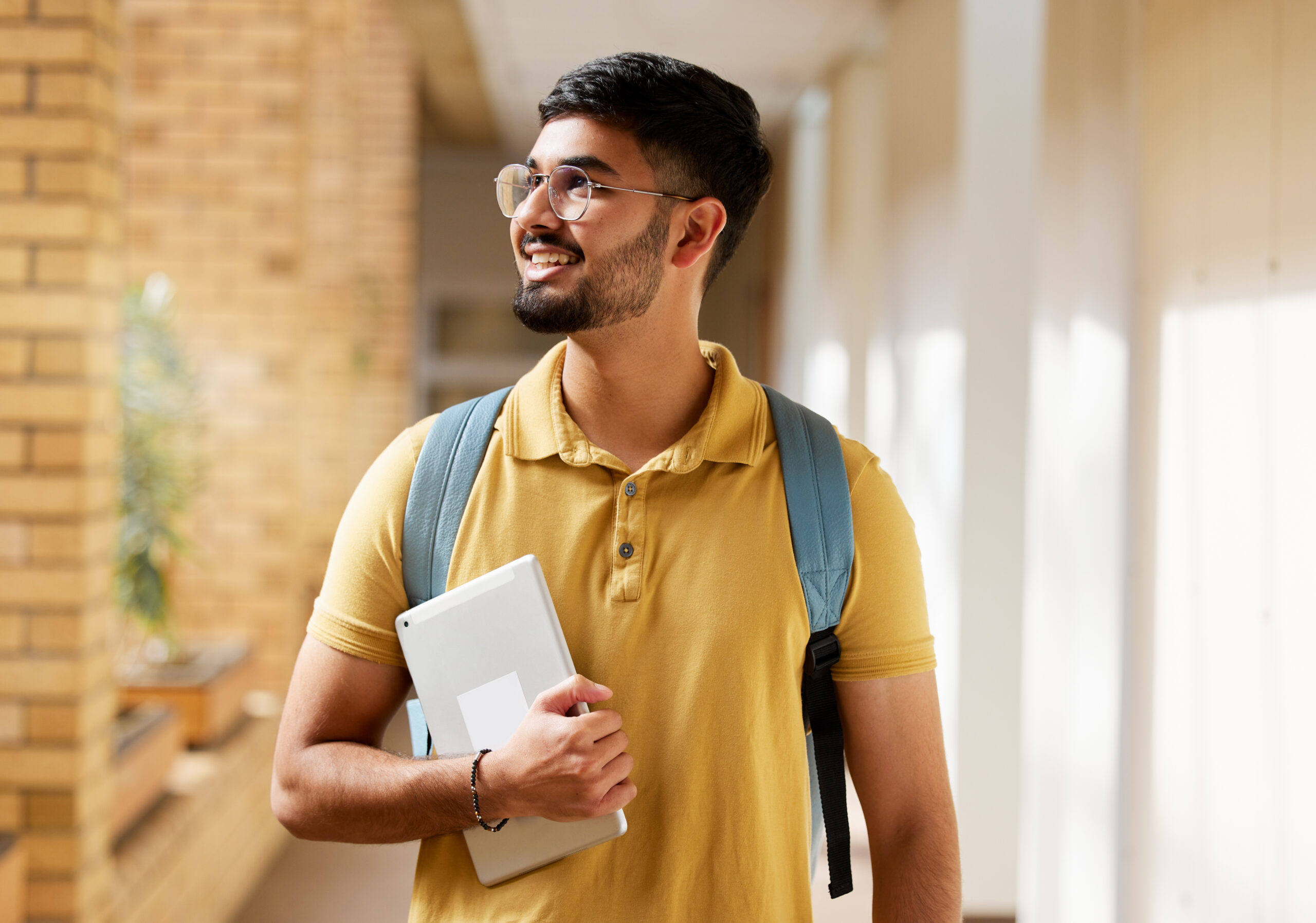 Man with a Tablet and Backpack