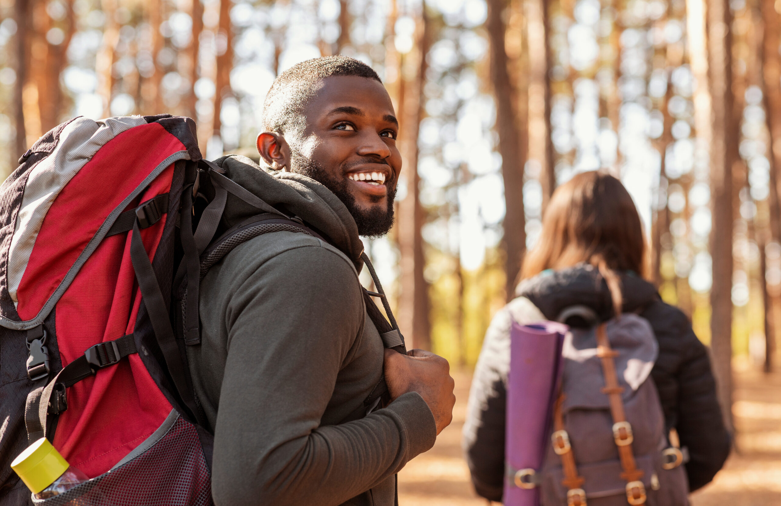 happy man and woman hiking together